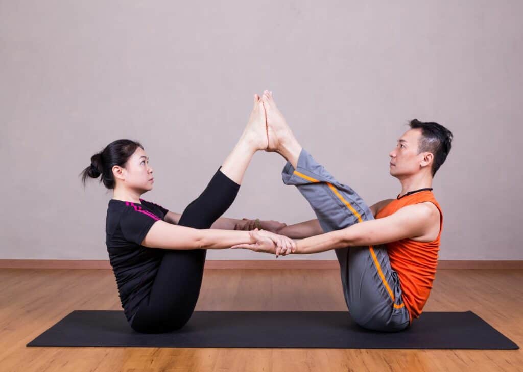 Partner Boat Pose - Uniting Body and Soul: The Joys and Benefits of Couples Yoga